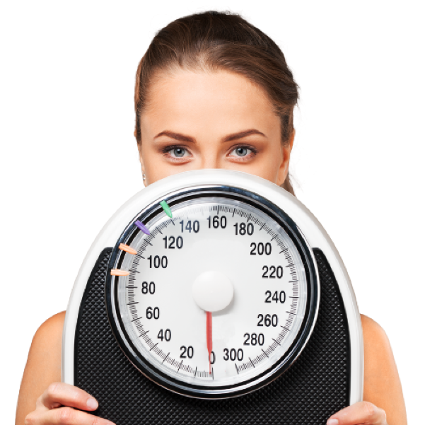 Female peeking over a scale, representing the topic of healthy weight loss at Roslyn Pharmacy
